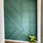 Entryway accent wall with a random geometric wainscoting