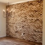 brick accent wall in a dining room